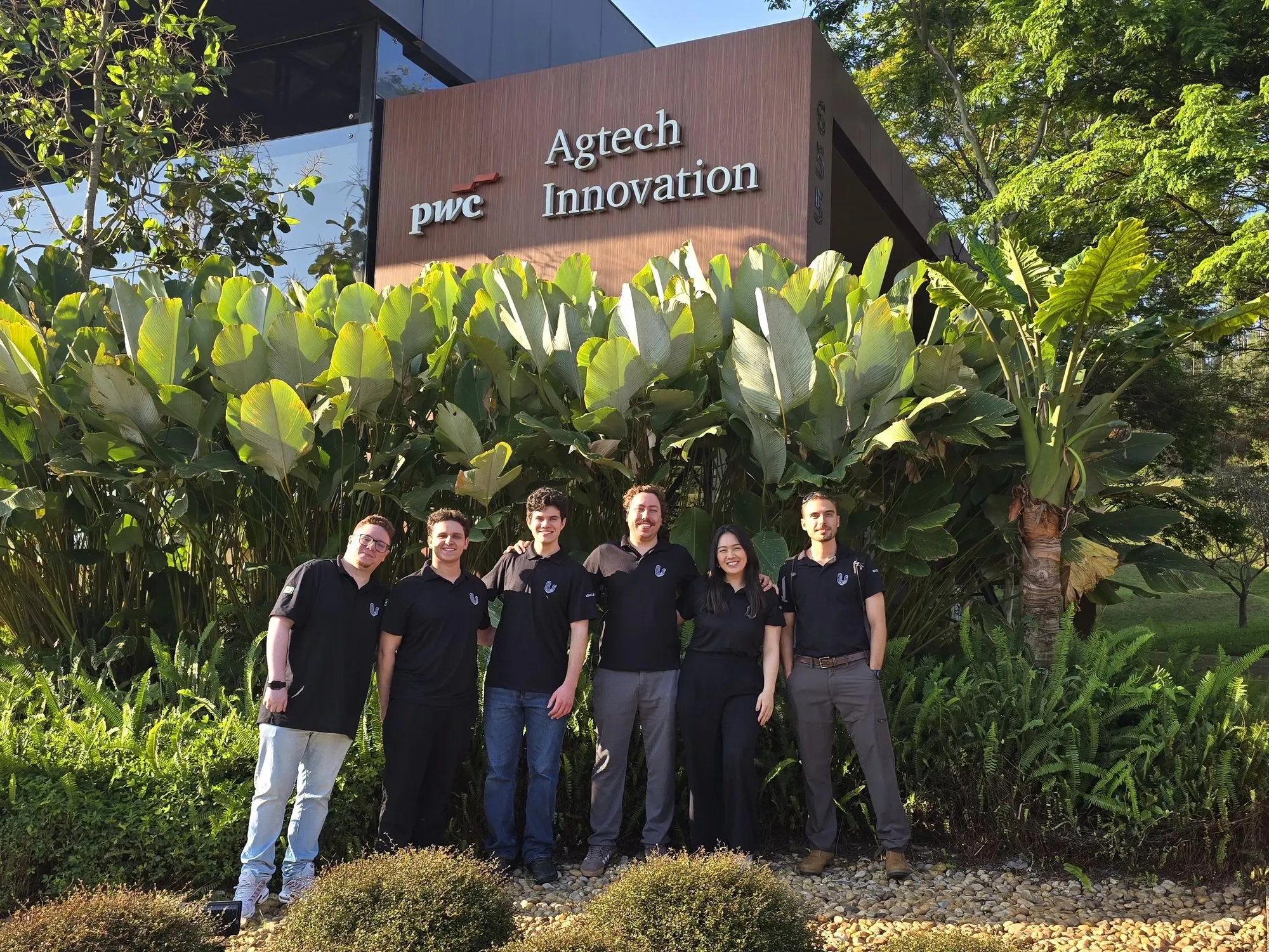 The Uzur team together outdoors
